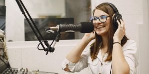 female-host-communicating-microphone-woman-radio-studio (1)